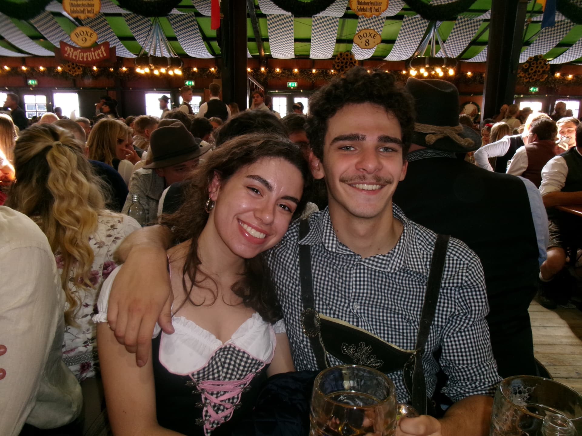 Two students at a festival table